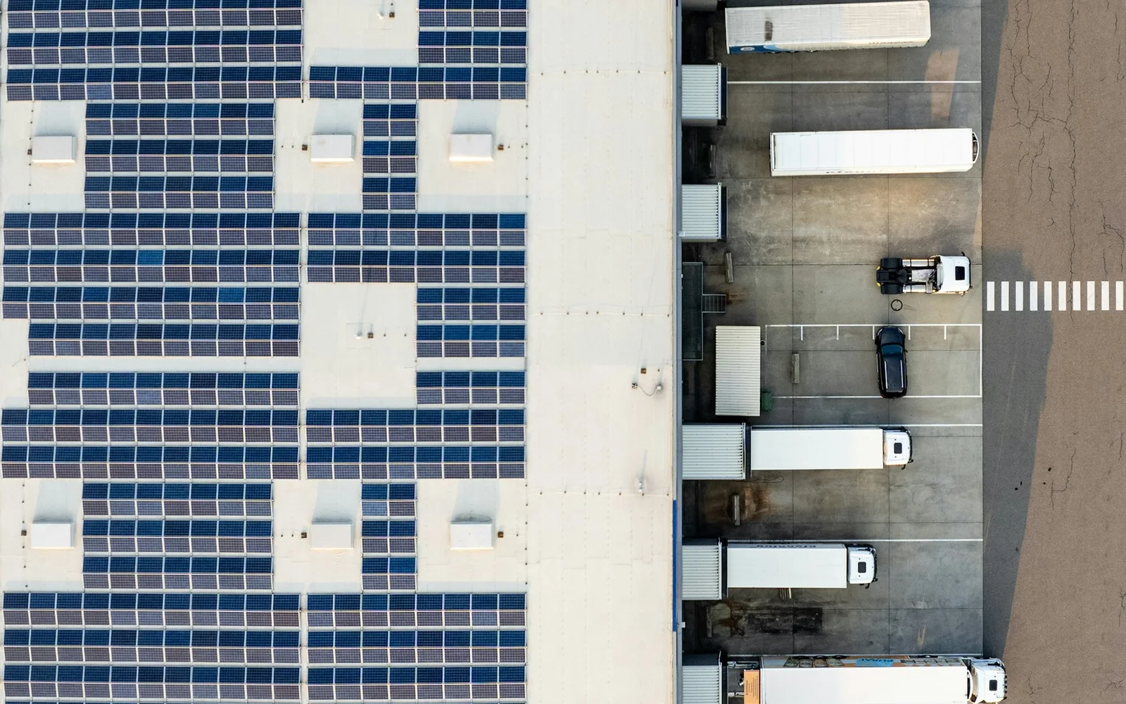 Modern distribution center with loading docks and organized vehicle movement